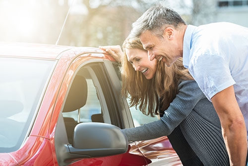 Couple Looking at Car