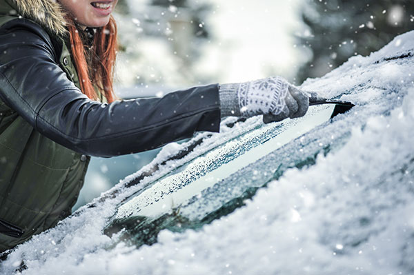 Woman Scraping Window