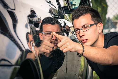 Man Looking at Car Door