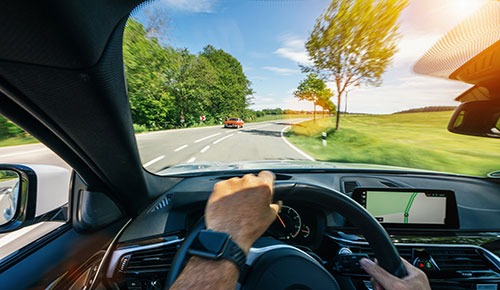 Hand on steering wheel